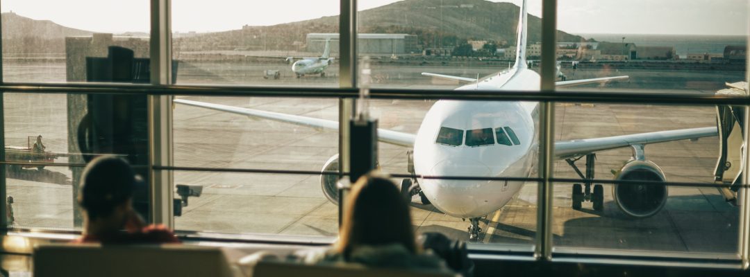 At the airport, a plane through the airport window