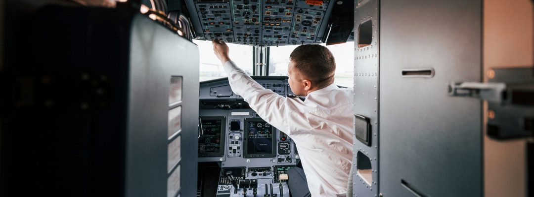 Control of the flight. Pilot on the work in the passenger airplane. Preparing for takeoff